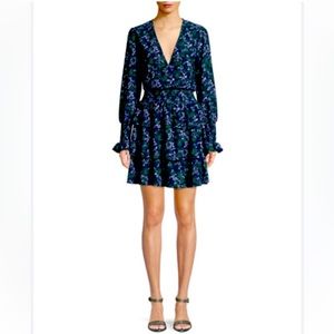 Long sleeve layered dress with floral print. Navy blue, green, and white.